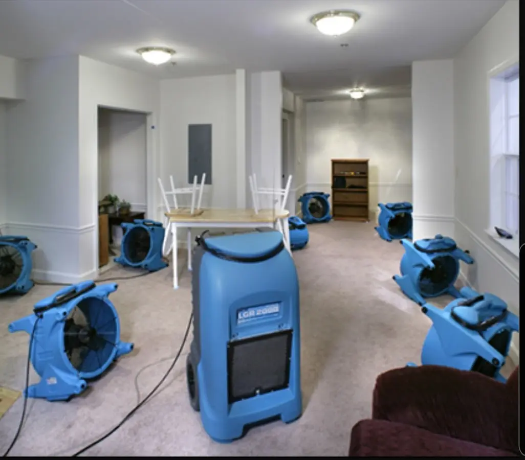 Air movers and dehumidifier setup for Water Damage Restoration in Salina